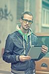 Man On Street Use Ipad Tablet Computer Stock Photo