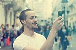 Man Photographing With Cell Phone Stock Photo