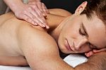 Man Receiving Relax Treatment At Spa Stock Photo