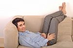 Man Relaxing On The Couch Stock Photo