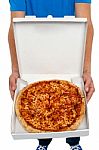 Man Showing Pizza Box Stock Photo