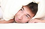 Man Trying To Sleep With Pillow Stock Photo