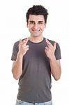 Man With Crossed Fingers Stock Photo