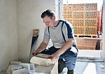Man Worker Measures The Ruler Silicate Brick Stock Photo
