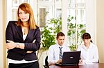 Manager With Employers In Office Stock Photo