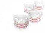 Many Pink Triangle Cosmetic Jar On White Background Stock Photo