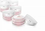 Many Pink Triangle Cosmetic Jar On White Background Stock Photo