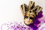 Masks And Feathers Of Venice Carnival On White Background Stock Photo