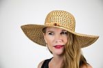 Mature Blonde Female In Large Hat And Black Top Stock Photo