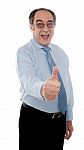 Mature Businessman With Thumbs Up Stock Photo