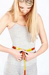 Measure Tape Around Woman's Waist Stock Photo