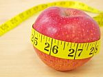 Measuring Tape Around Apple Stock Photo