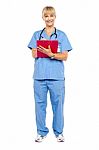 Medical Practitioner Posing With A Clipboard Stock Photo