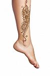 Mehendi Or Henna Tatoo On The Female Leg In Bracelets Isolated O Stock Photo