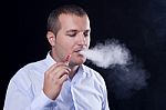 Men Smoke An Electronic Cigarette Stock Photo