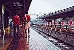 Men Walking Through A Railway Station In India Stock Photo