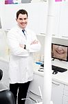 Middle Aged Male Doctor In His Clinic Stock Photo