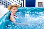 Middle Aged Woman Bathing In Hot Tub Stock Photo