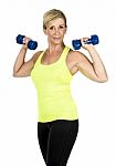 Middle Aged Woman Doing Exercise Stock Photo