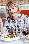 Middle Aged Woman Eating Healthy Food Stock Photo