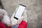 Mobile Phone In Hands With Glowes, Cold Weather Stock Photo