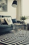 Modern Living Room With Sofa, Pillows, Lamp And Table On Graphic Stock Photo