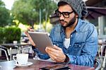 Modern Young Man With Digital Tablet In The Street Stock Photo