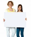Mom And Daughter With Blank Board Stock Photo