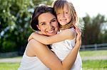 Mother And Daughter Having Fun Outdoors Stock Photo