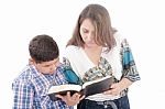 Mother And Son Reading A Bible Over A Black Background Stock Photo