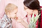 Mother Feeding Child Stock Photo