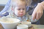 Mother Feeding Porridge Her Child, Healthy Breakfast Stock Photo