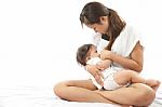 Mother Is Breast Feeding For Her Baby Stock Photo