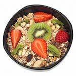 Muesli And Fruits In Bowl Isolated Stock Photo