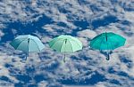 Multicolored Umbrellas Against  Blue Sky Background Stock Photo