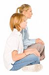 Mum And Son Sat On The Floor Smiling Isolated On White Backgroun Stock Photo