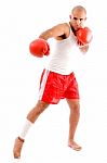 Muscular Man In Punching Pose Stock Photo