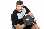 Muscular Man Working Out With Barbell Stock Photo