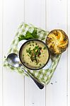 Mushroom Soup With A Bread Roll And Parsley Stock Photo