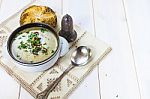 Mushroom Soup With A Bread Roll And Parsley Stock Photo