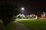 Night Public Park In The City With Houses Near Stock Photo