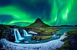 Northern Light, Aurora Borealis At Kirkjufell In Iceland. Kirkjufell Mountains In Winter Stock Photo