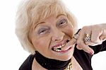 Old Woman With Finger In Her Mouth Stock Photo
