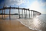 Old Wooden Bridge And Beach Stock Photo