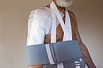 Older Man With Arm In Sling Stock Photo