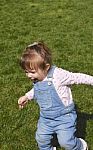 One Year Old Running On Grass Stock Photo