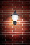 Open Light Lamp On Brick Wall Stock Photo