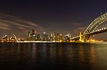 Opera House And Harbour Bridge In Sydney At Night, It Is Illumin Stock Photo