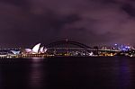 Opera House And Harbour Bridge In Sydney At Night, It Is Illumin Stock Photo