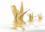 Origami crane floating in water Stock Photo